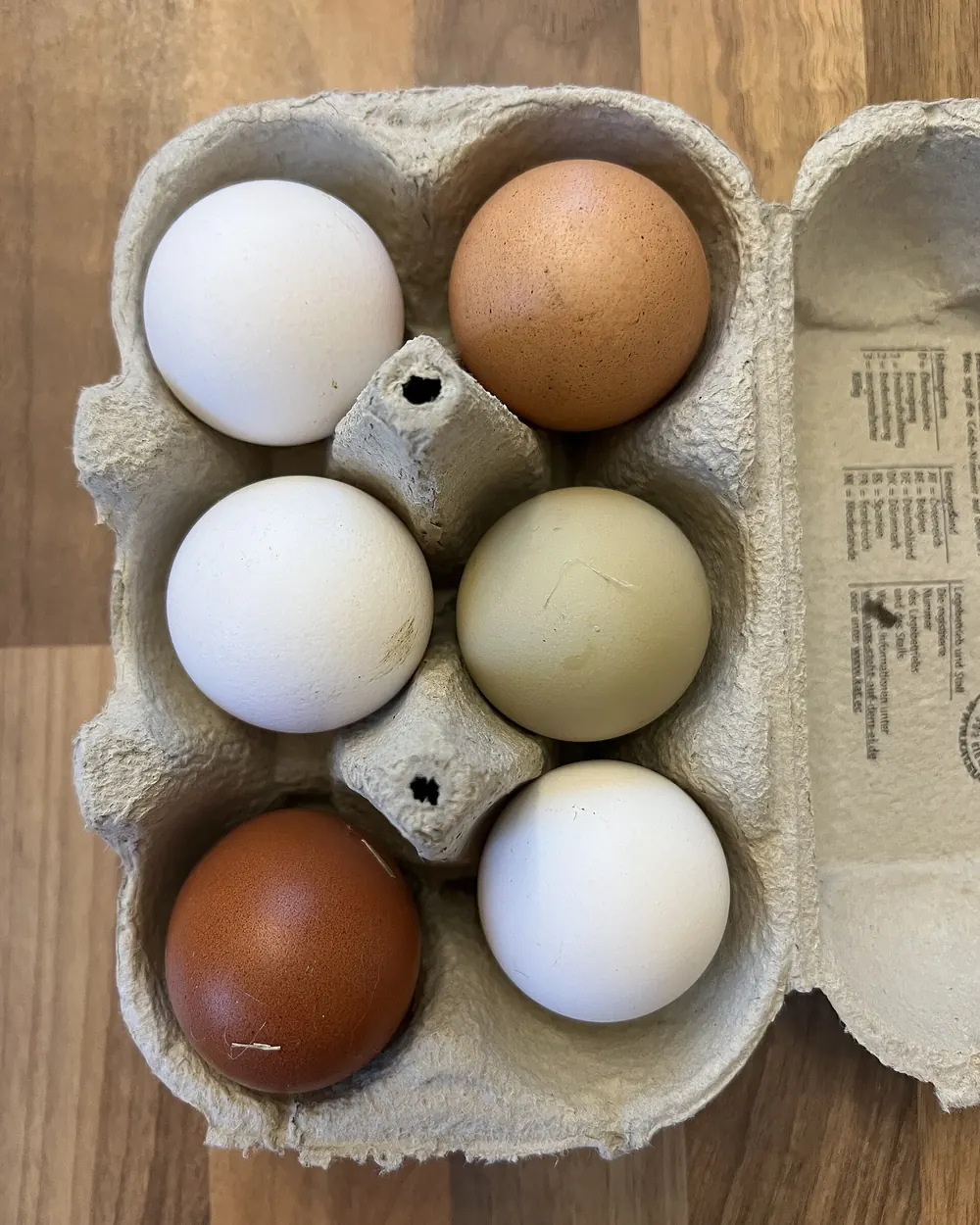Fresh eggs in a carton.