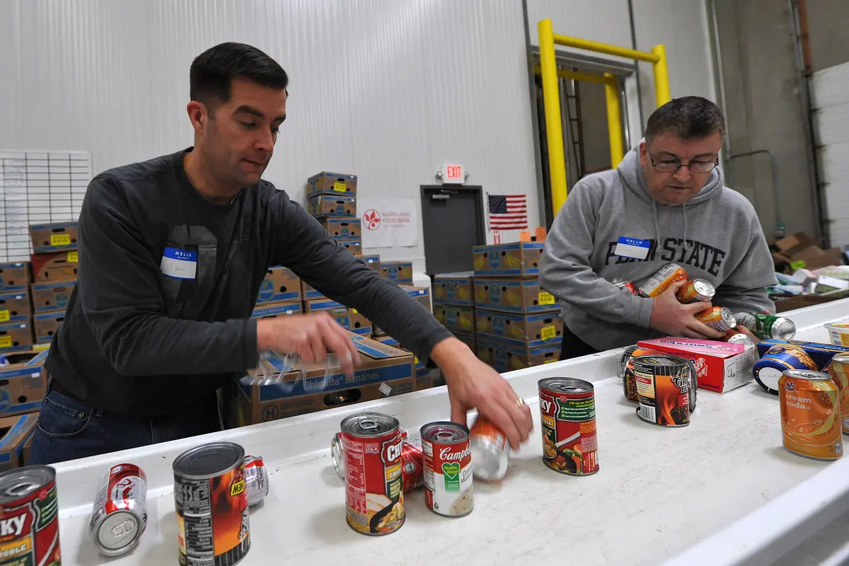 Volunteers packing food at a food bank.